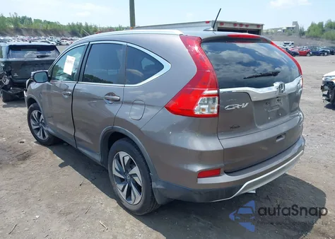 2015 Honda Cr-V Touring z USA, uszkodzony, nr VIN 5J6RM4H91FL058769